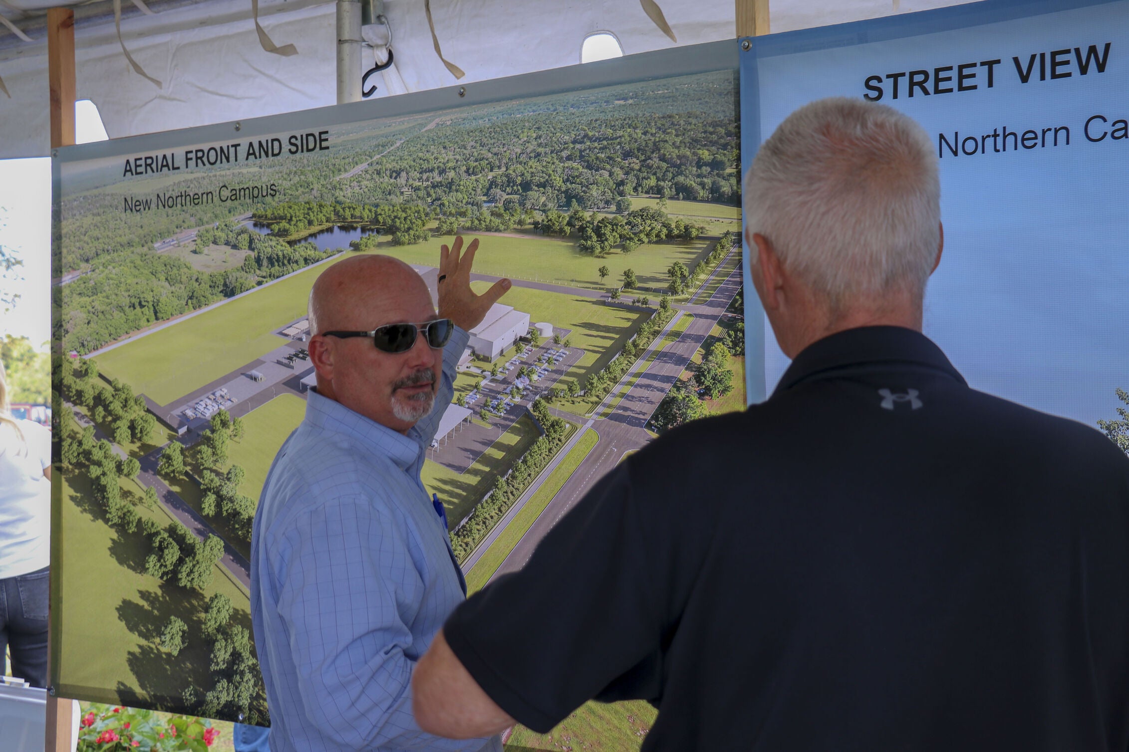 SECO Energy's Director of Facilities Management & Fleet Services, Brian Knappenburger, answers questions about the new facility as guests view renderings of the future Northern Operations Center.