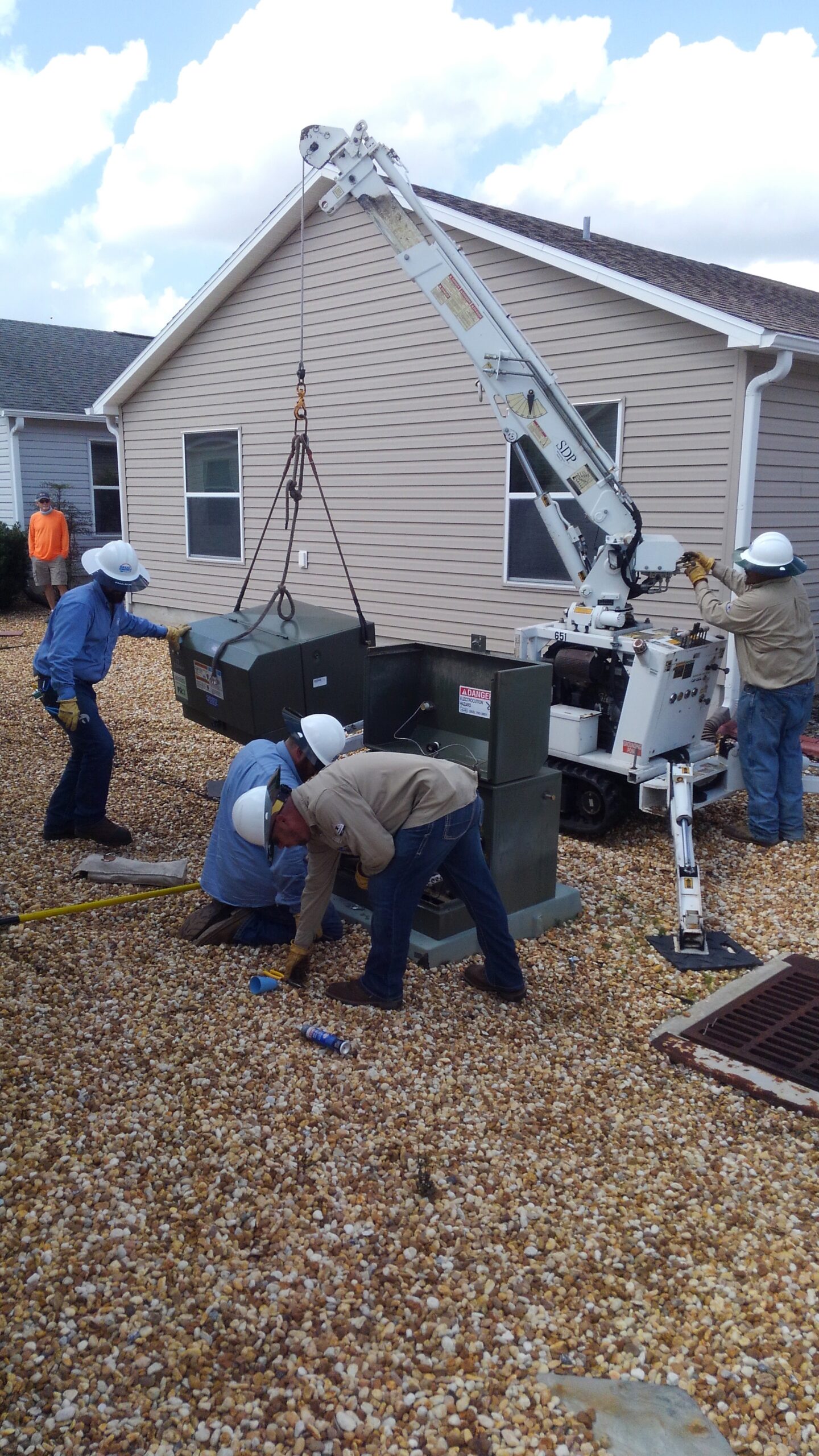 Crews replacing a transformer near a home in The Villages.