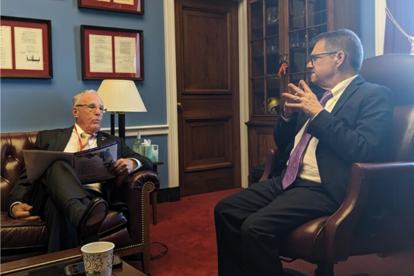 SECO Energy Board of Trustees President Gerald Anderson speaks with Congressman Gus Bilirakis